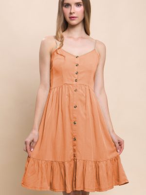 Vestido con botones a media pierna, resorte en espalda.